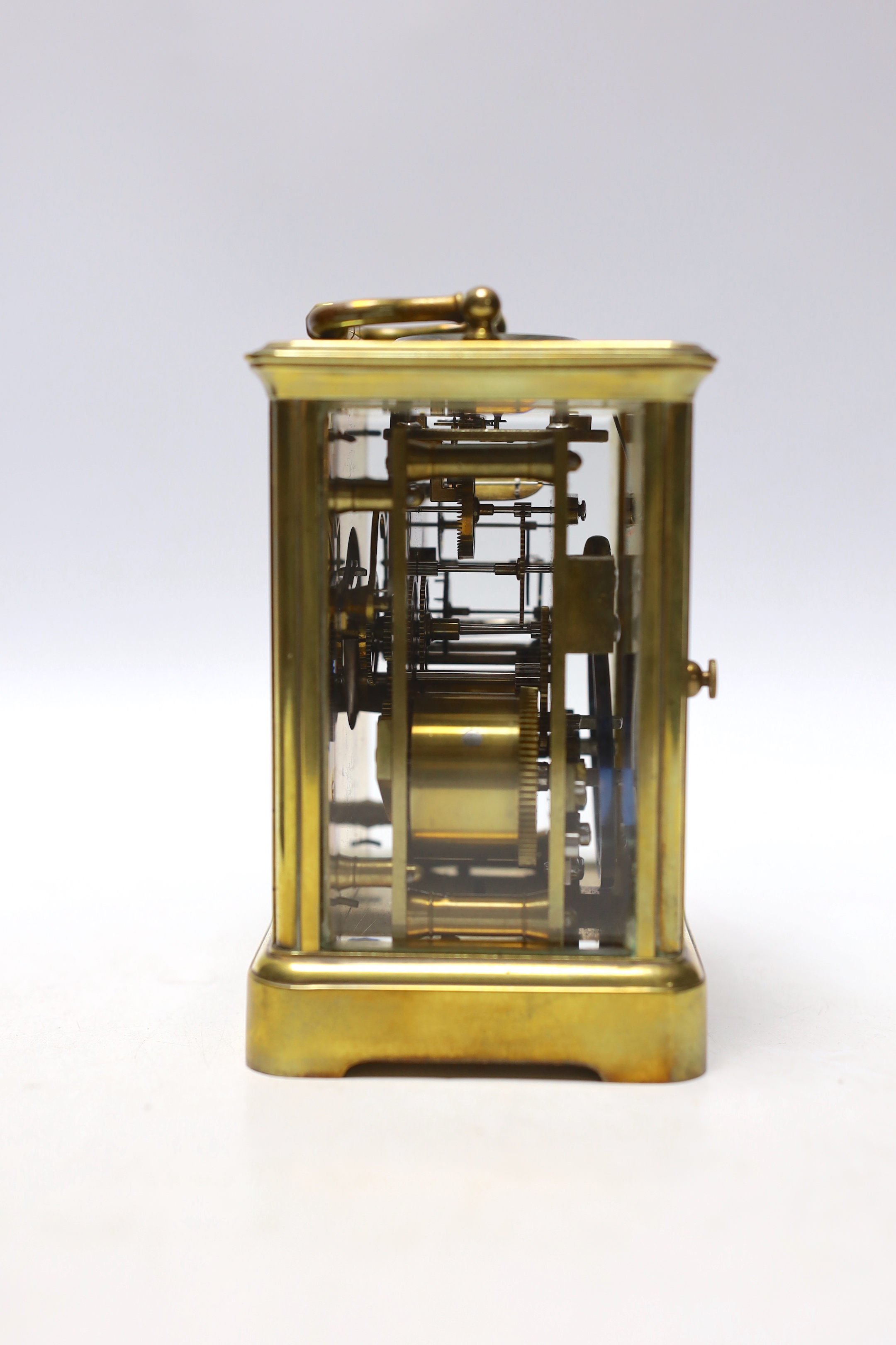 A Curtis brass carriage timepiece, in leather case, 15cm high